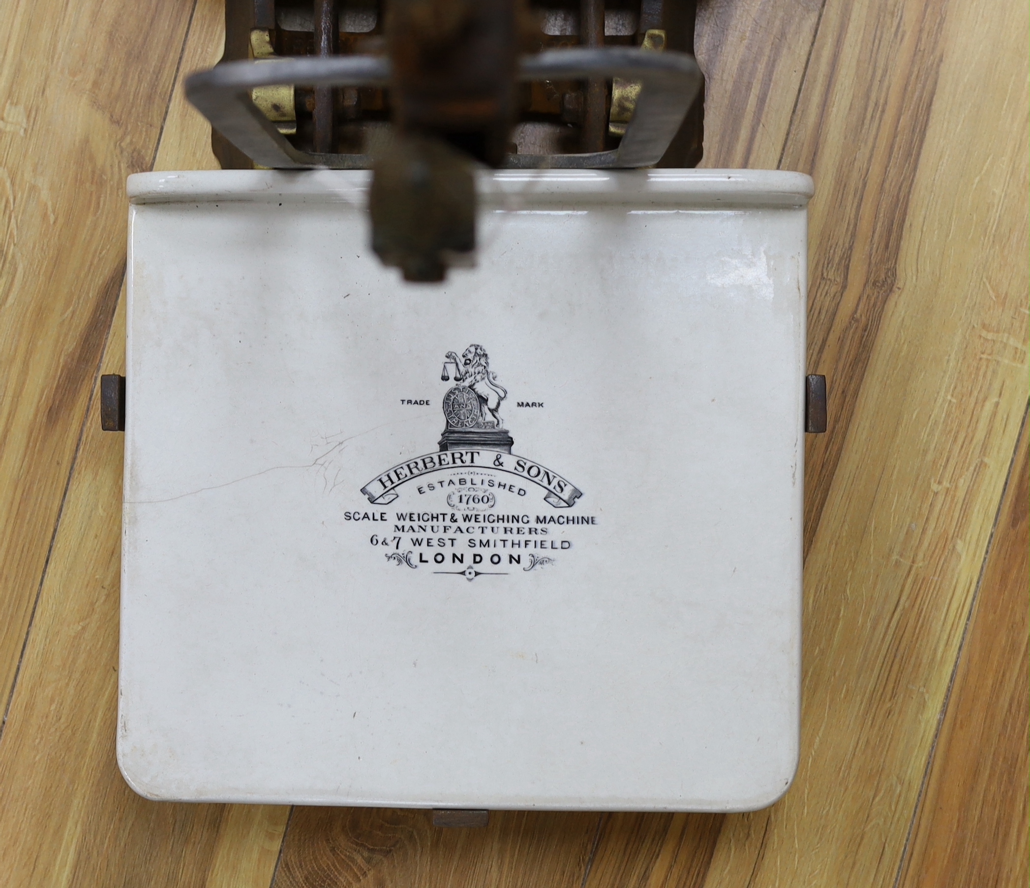 A 19th century Herbert & Sons Ltd. cast iron and porcelain scale set, height 76cm